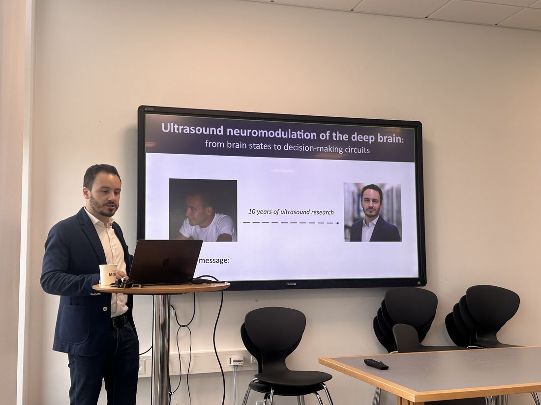 Davide Folloni beside his title slide during his invited lecture at TNU.
